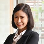 Young businesswoman in office room, Portrait shot and looking at camera.